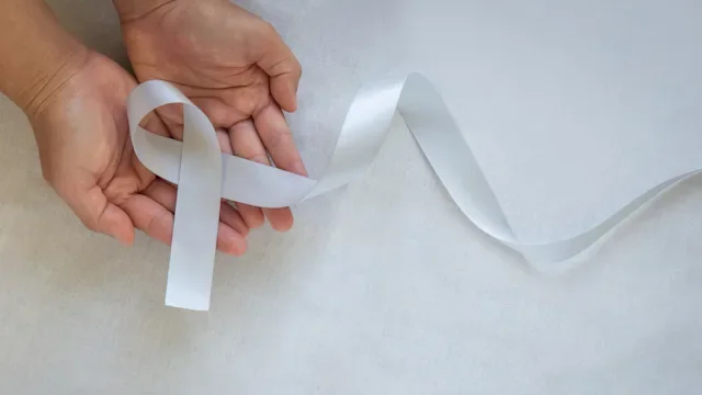 white gray cause ribbon in hands-1291573928
