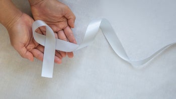 white gray cause ribbon in hands-1291573928