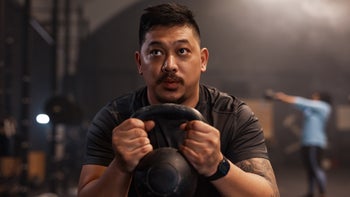 Movement-exercise: man exercising with kettle bell 1352379152