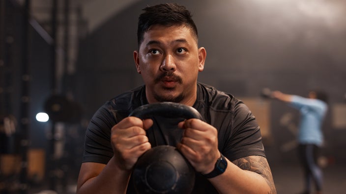 Man exercising with a kettlebell