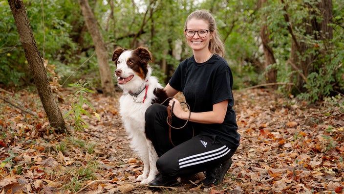 Dog trainer Beck Skaggs is pictured with her Australian shepherd, Dak.