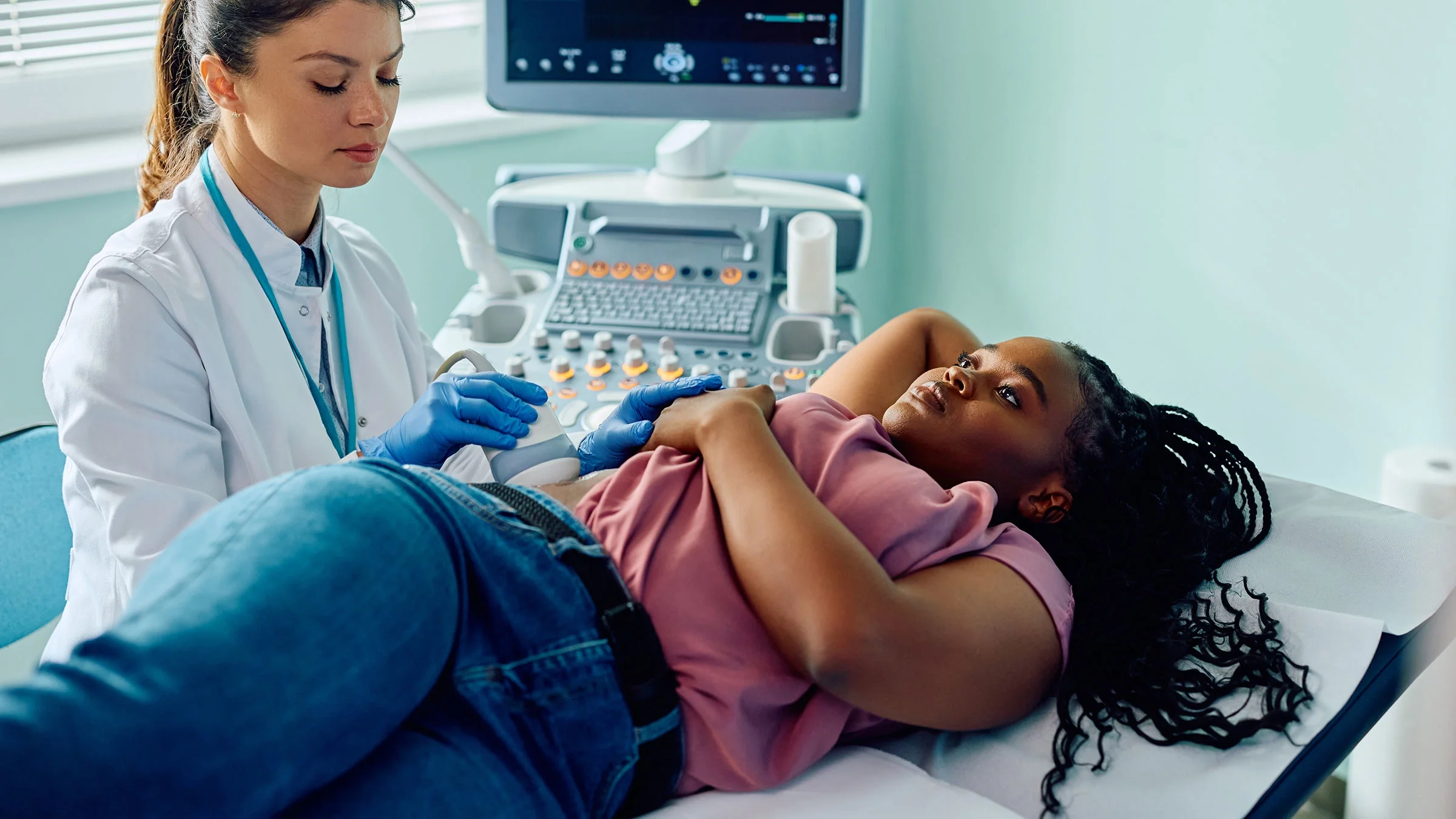 A Black woman gets an ultrasound. Black women experience fibroids at higher rates.
