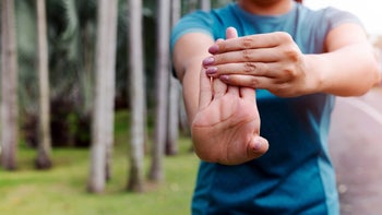 Health: Movement and exercise: closeup woman wrist flexor -stretch 1171684321