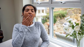 Xywav: woman yawning from daytime sleepiness 1356375917