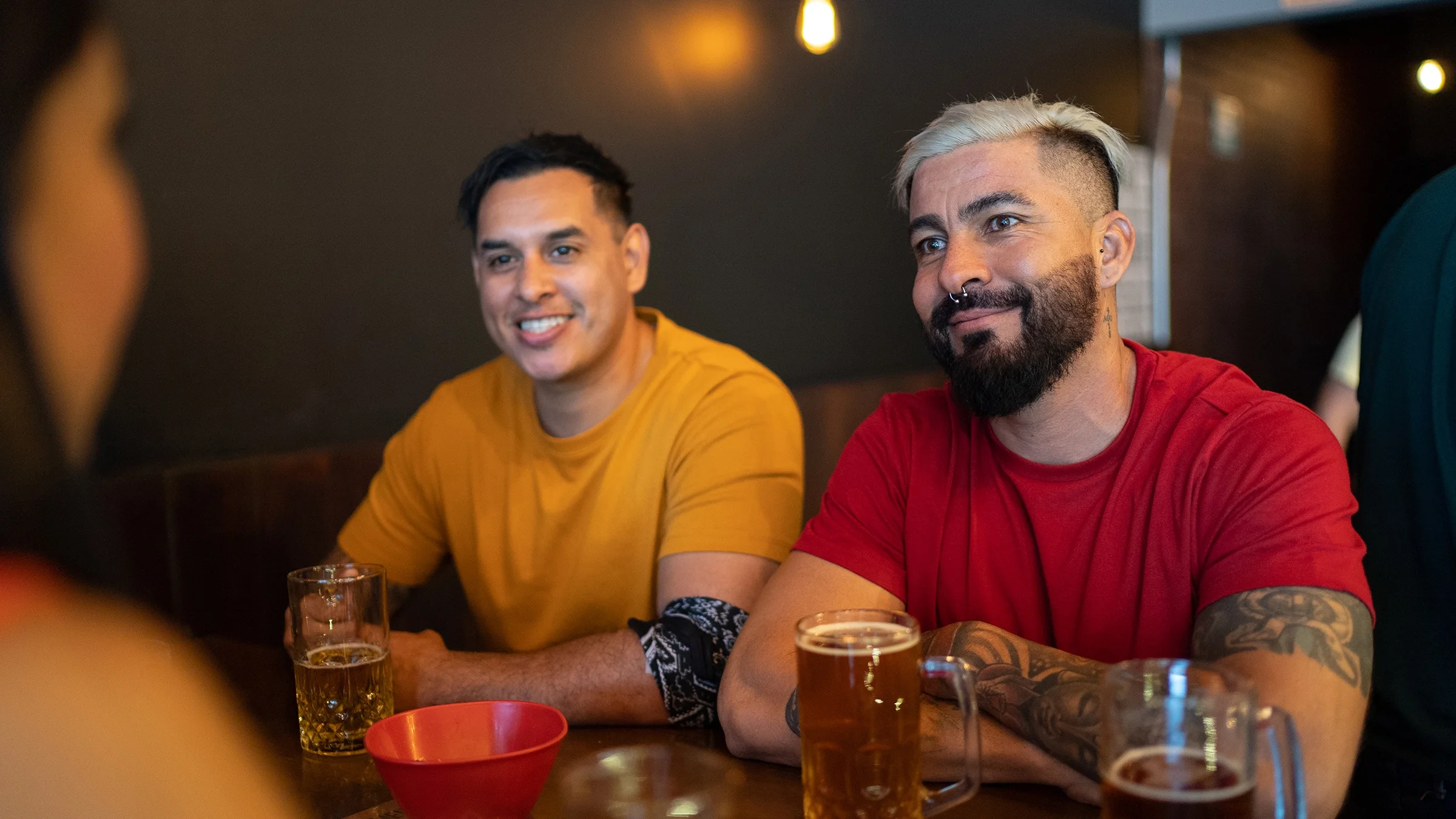 Friends hang out at a bar.