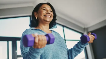 Movement Exercise: woman doing bicep curls 2250873295