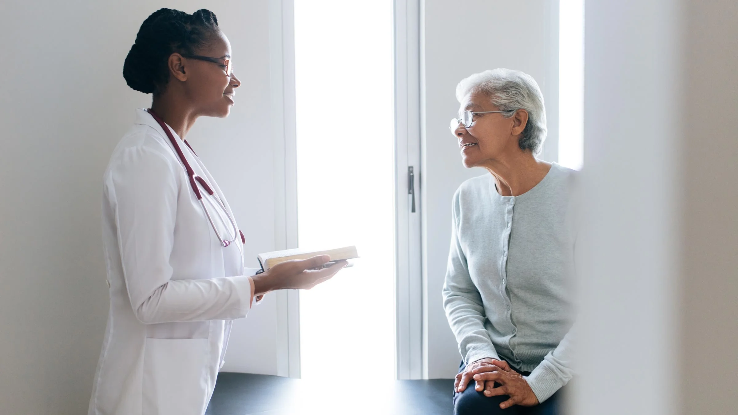 A patient consults a doctor during an appointment.