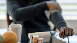 A man checks his blood pressure at home.
FatCamera/iStock via Getty Images Plus