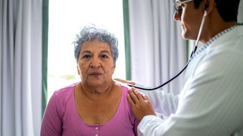 COPD: doctor listening to patient heartbeat 2176402681