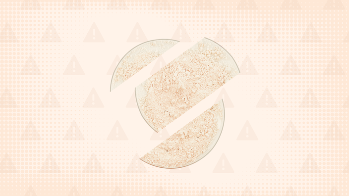 Light, peach-colored background with texture and warning sign pattern. In the center is a bowl of white powder cut into thirds. 