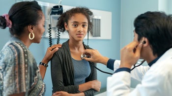 Black health: girl at doctors appointment 1168997473