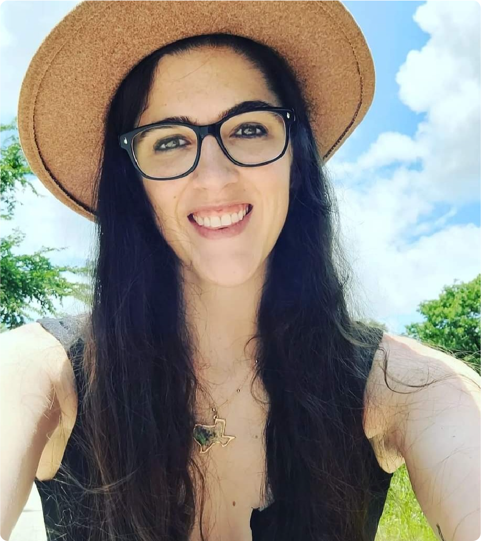 Bri Thomas is pictured wearing a sunhat outdoors.