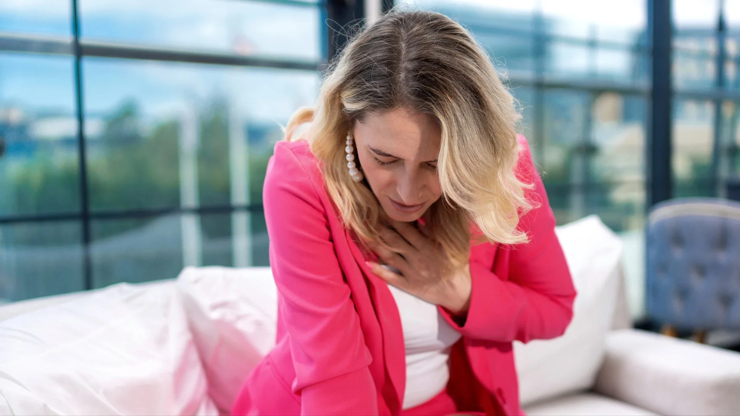 A person experiencing chest pain on a couch.
turk_stock_photographer/iStock via Getty Images Plus