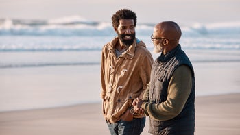 Health: Alcohol use disorder: adult son and father walking on beach-1201593827