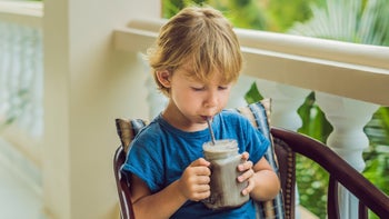 childrens-health: child drinking with a straw 1216542570