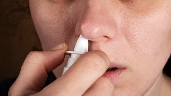Health: Opioid Antagonists: closeup person using nasal spray 1335207910