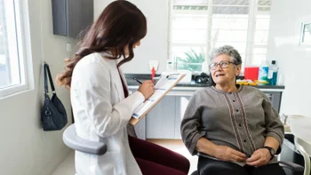 Affordable dental care: senior woman at dentist 1418280048