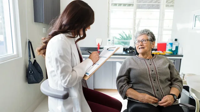 Affordable dental care: senior woman at dentist 1418280048