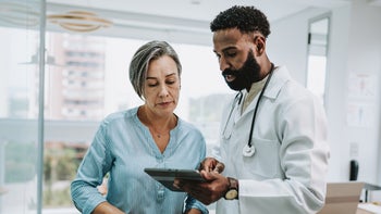 Zymfentra: doctor speaking with patient 1935661293