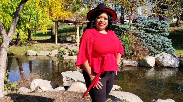 DeQuindra Blakey standing in front of a Japanese garden.