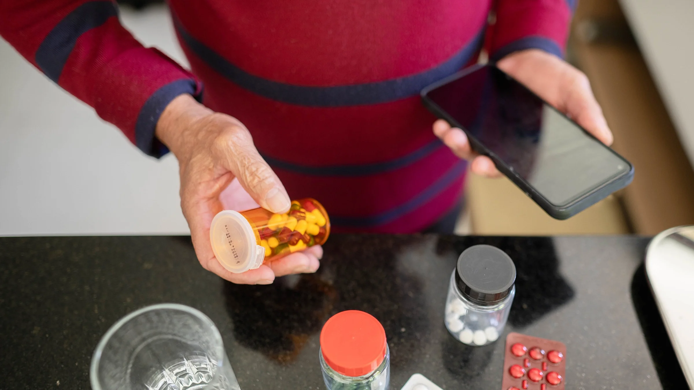 A man researches his medication using his phone.