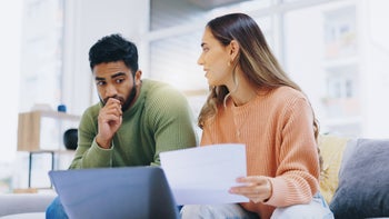 Personal finance: man woman discuss finances 1957573744