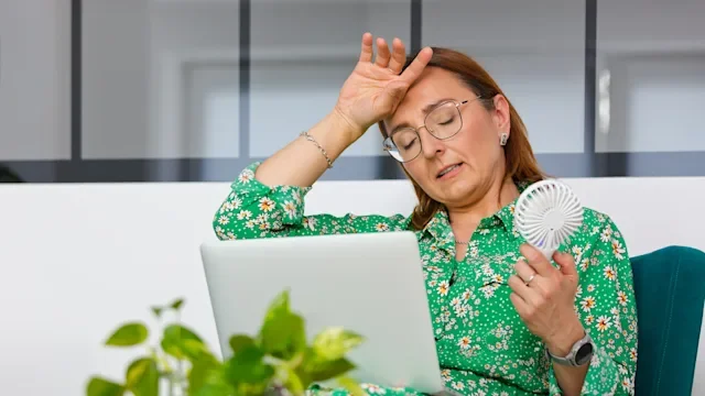 menopause: menopausal woman working 2154134231