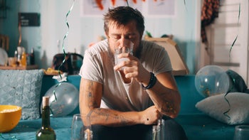 Alcohol: man recovering from hangover 1354895456
