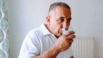 Men's Health: man taking medication at home 1498982231