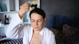Woman applying hair serum.
Viktoriia Yakovenko/iStock via Getty Images Plus
