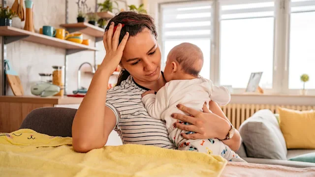 Parenthood pregnancy new parent depression holding baby- 1351160342