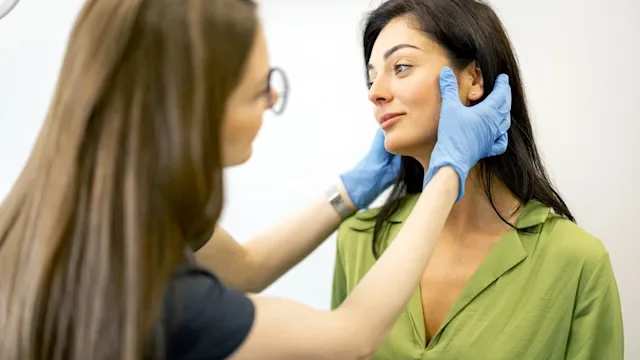 Dermatology hcp: HCP examines patients face 1693429392