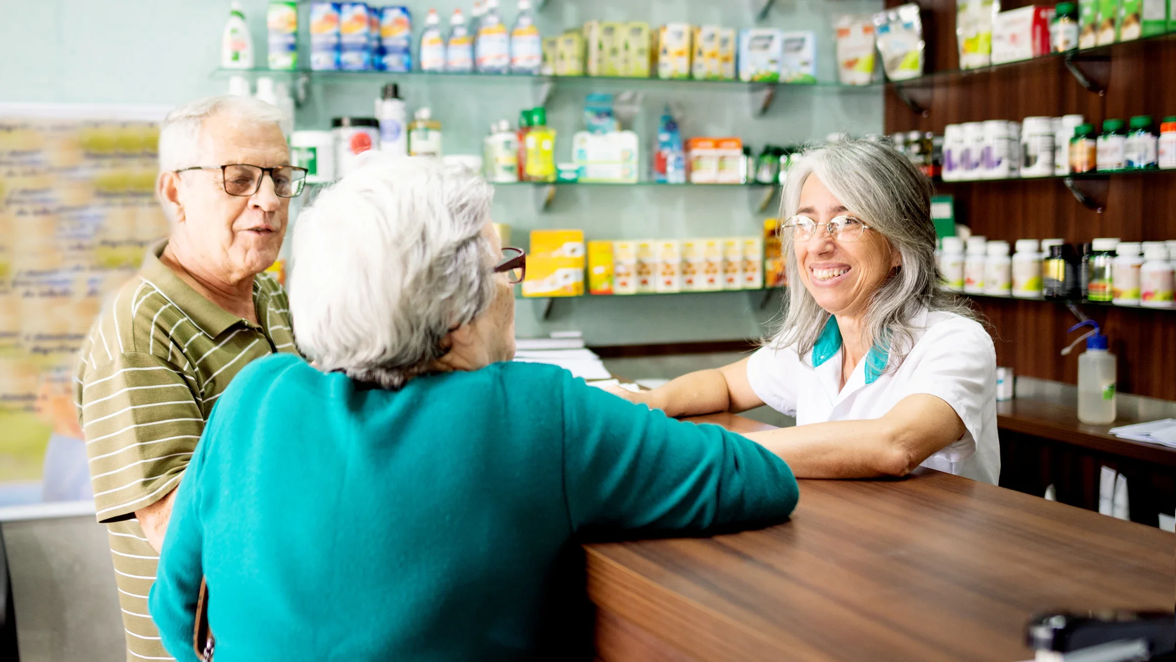 Pharmacist speaking to customers.
Giselleflissak/E+ via Getty Images