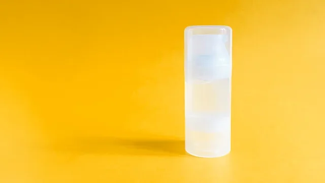 Health: Sexual health: lube bottle orange background-1330859310