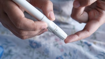 Eating disorder: diabulimia diabetes: close-up using glucometer 1207495409