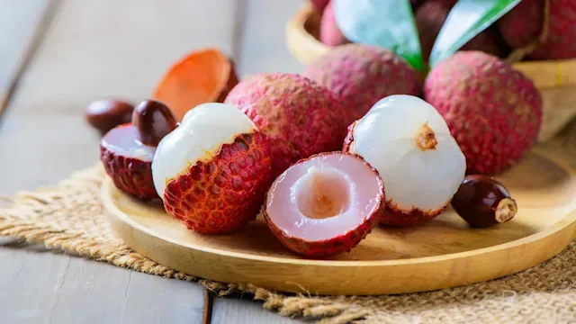 diet-nutrition: fresh lychees on wooden plate 2220258953