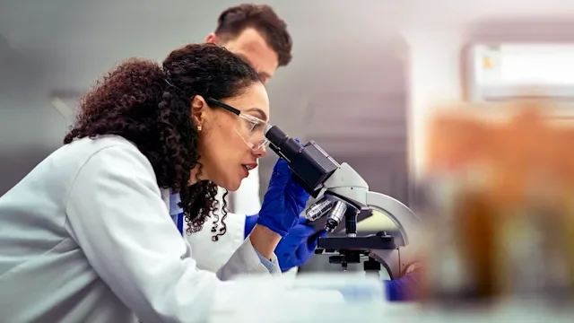 Peptides: researcher testing under a microscope 1530975485
