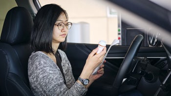 Health: Pharmacies: woman drive thru pharmacy 218468078