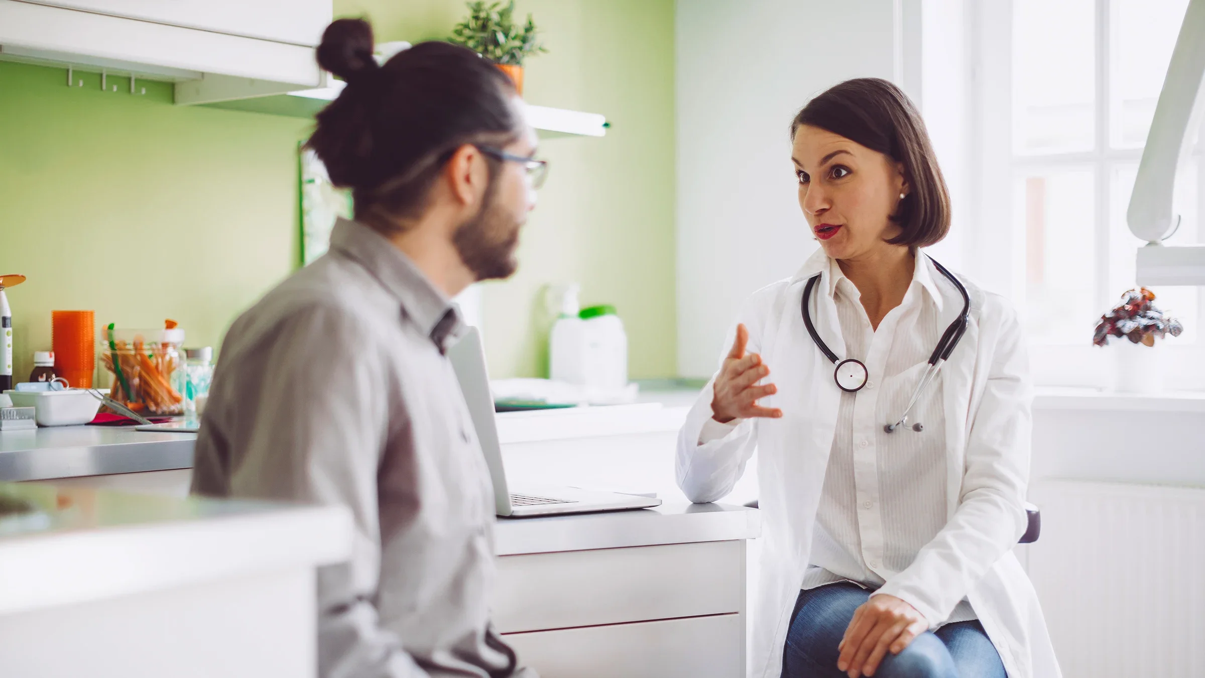 A man talks with a healthcare professional. Having stringy stool can indicate several things, from undigested fiber to conditions like Crohn’s disease.Eva-Katalin/E+ via Getty Images
