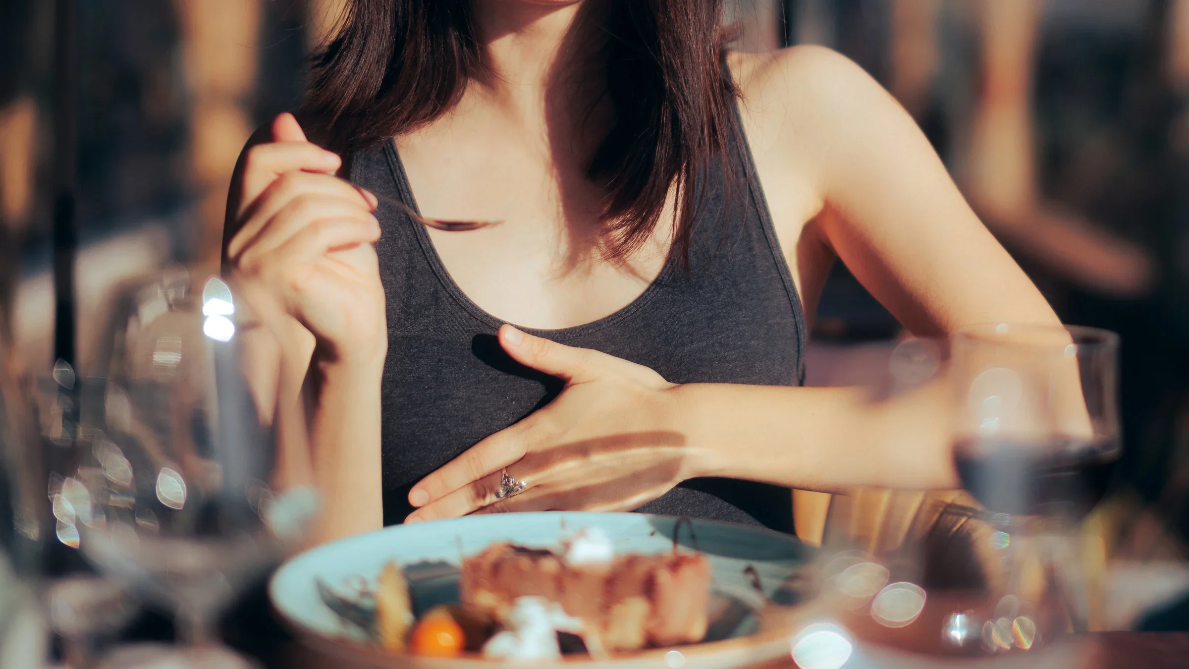 Cropped image of a person feeling sick during a meal.
nicoletaionescu/iStock via Getty Images Plus 
