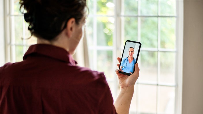 A woman is talking with her healthcare provider about postmenopausal bleeding.