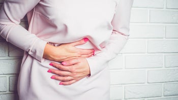 Hematology: Women's Health: closeup woman abdominal pain 868196718