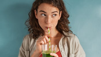 Diet Nutrition: woman drinking green juice 1289221014