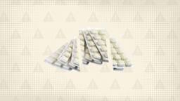 Yellowish white background with texture and warning sign pattern. In the center are blister packs of nicotine gum cut into thirds. 
GoodRx Health