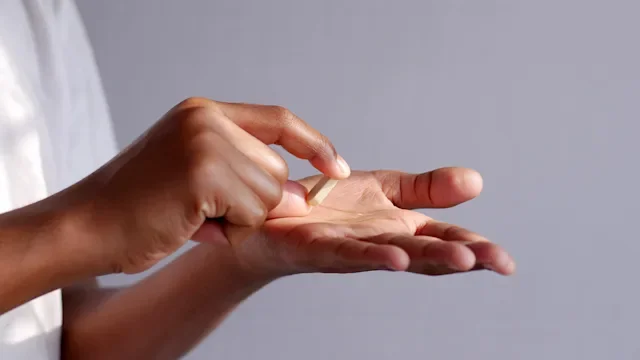 Medication Education: closeup pill in hand 1412349154