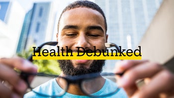 Eye: debunked man putting on glasses 627103814