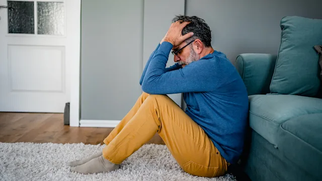 Beta blockers: man with face in his hands 2030875969