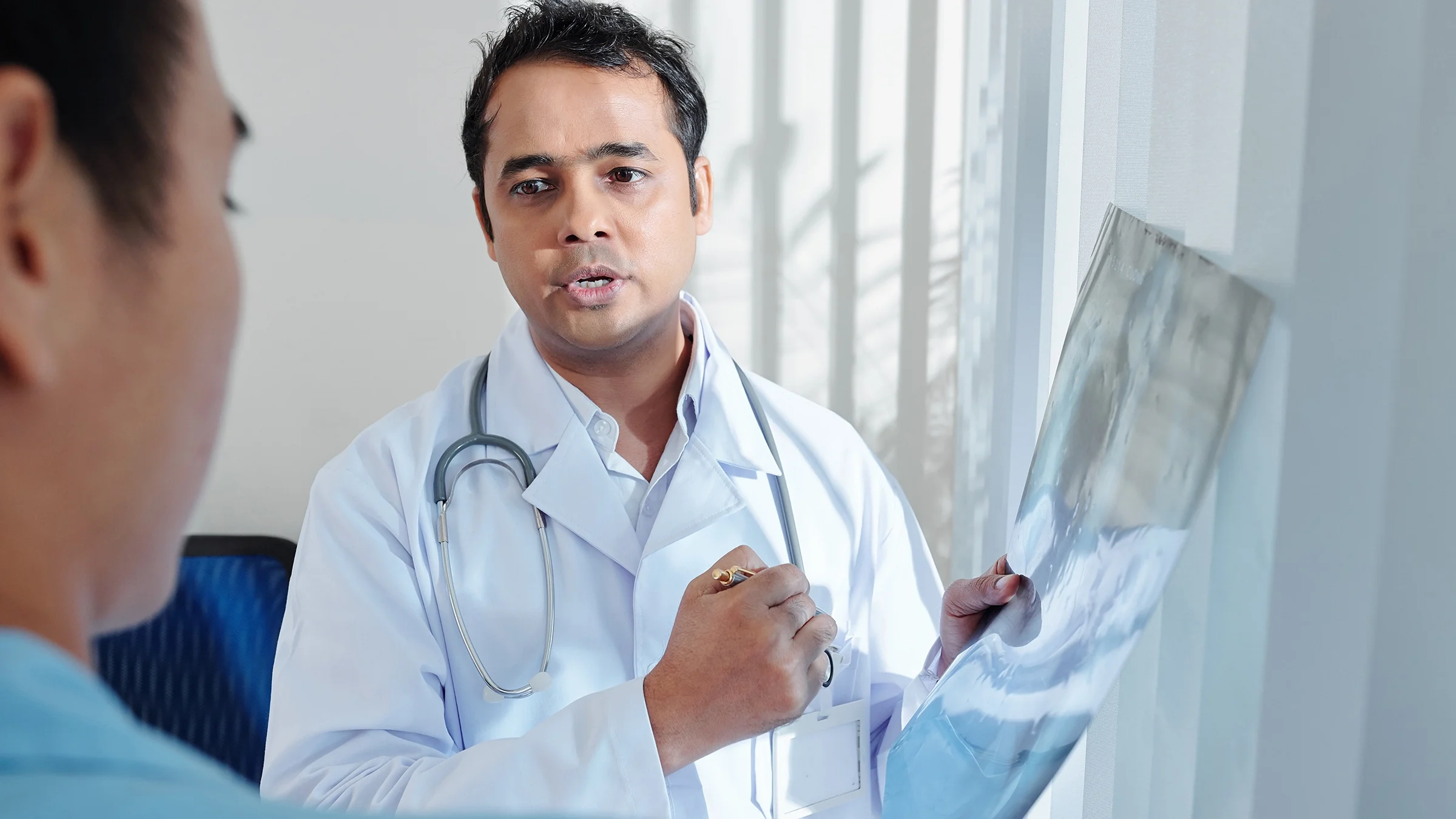 Medical professional explaining X-ray.