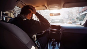 Mental health: man frustrated behind the wheel 1083341314