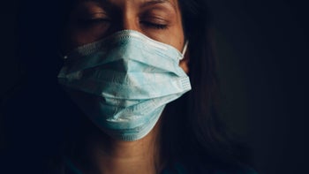 HCP: Abuse: closeup woman with mask closing eyes-1218864339